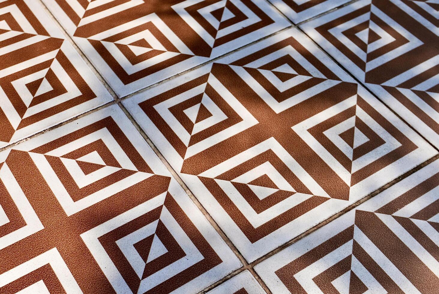 Abstract decorative brown and white floor tile pattern object isolated on horizontal ratio background. photo