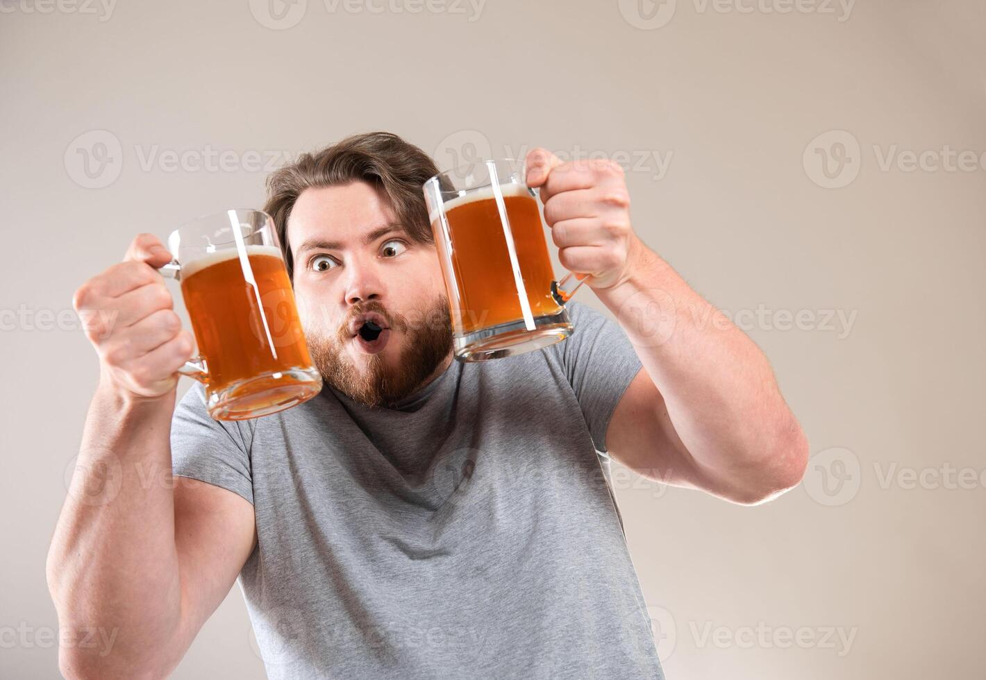 young handsome caucasian man happy expression and holding a beer photo