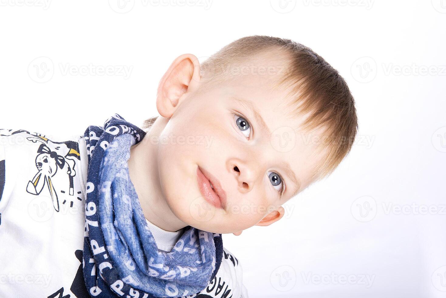 Portrait of happy joyful little boy isolated on white background photo