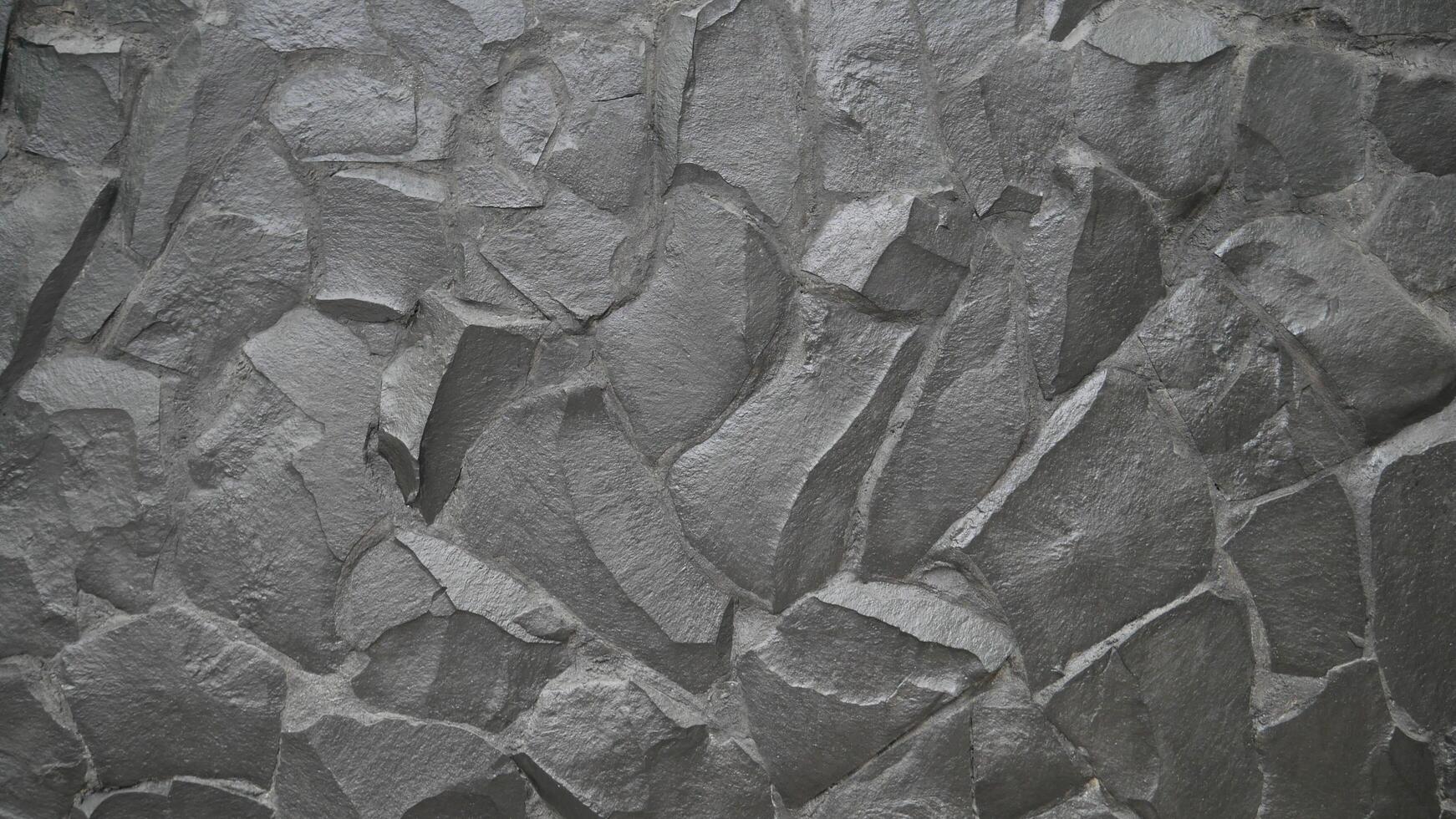 Grey rock stone texture background wall pattern, top view. Background design for dark wallpaper. photo