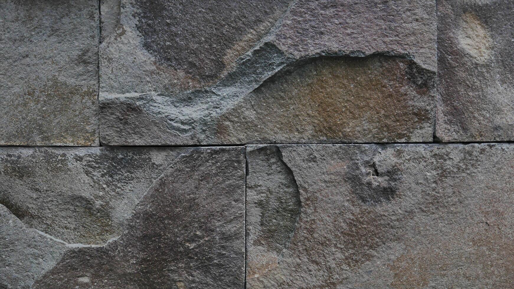 Grey rock stone texture background wall pattern, top view. Background design for dark wallpaper. photo