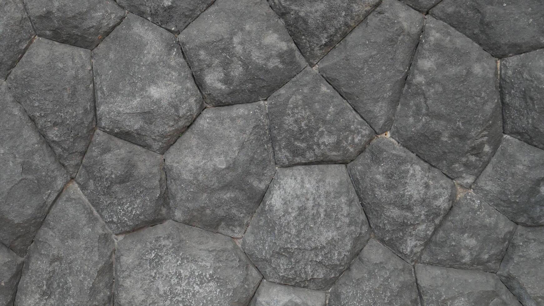 Grey rock stone texture background wall pattern, top view. Background design for dark wallpaper. photo