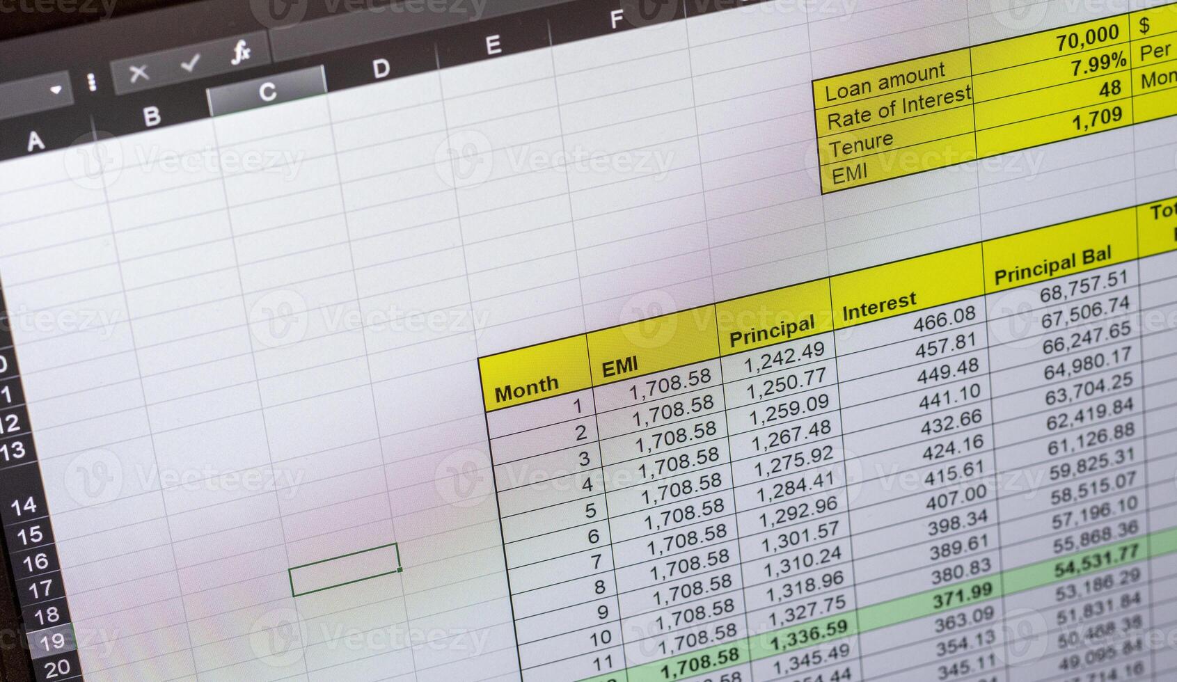 Shot of an dark mode excel sheet on computer screen showing bank loan amortization table. Banking photo