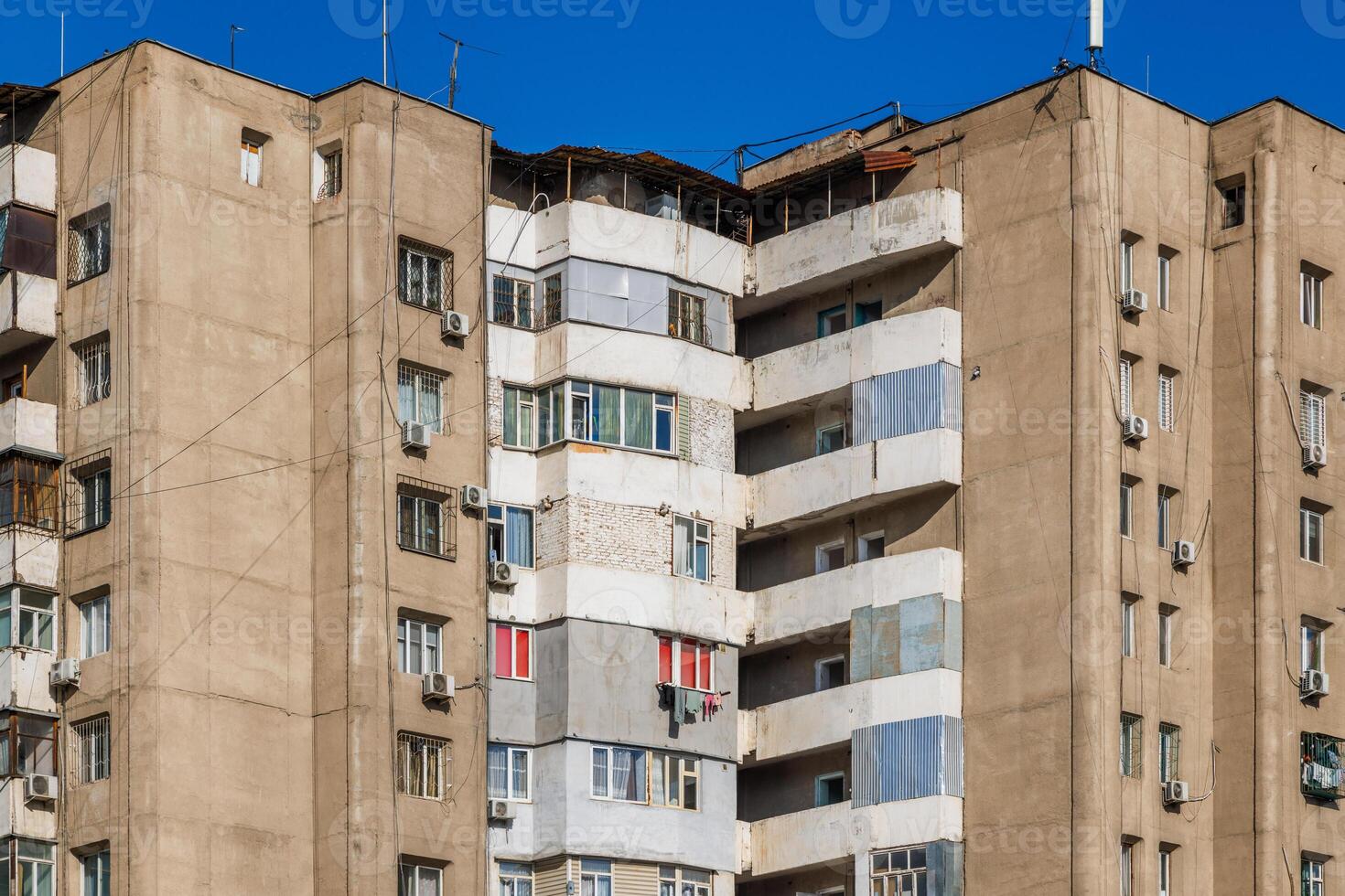 poor multistory apartment building at sunny day photo