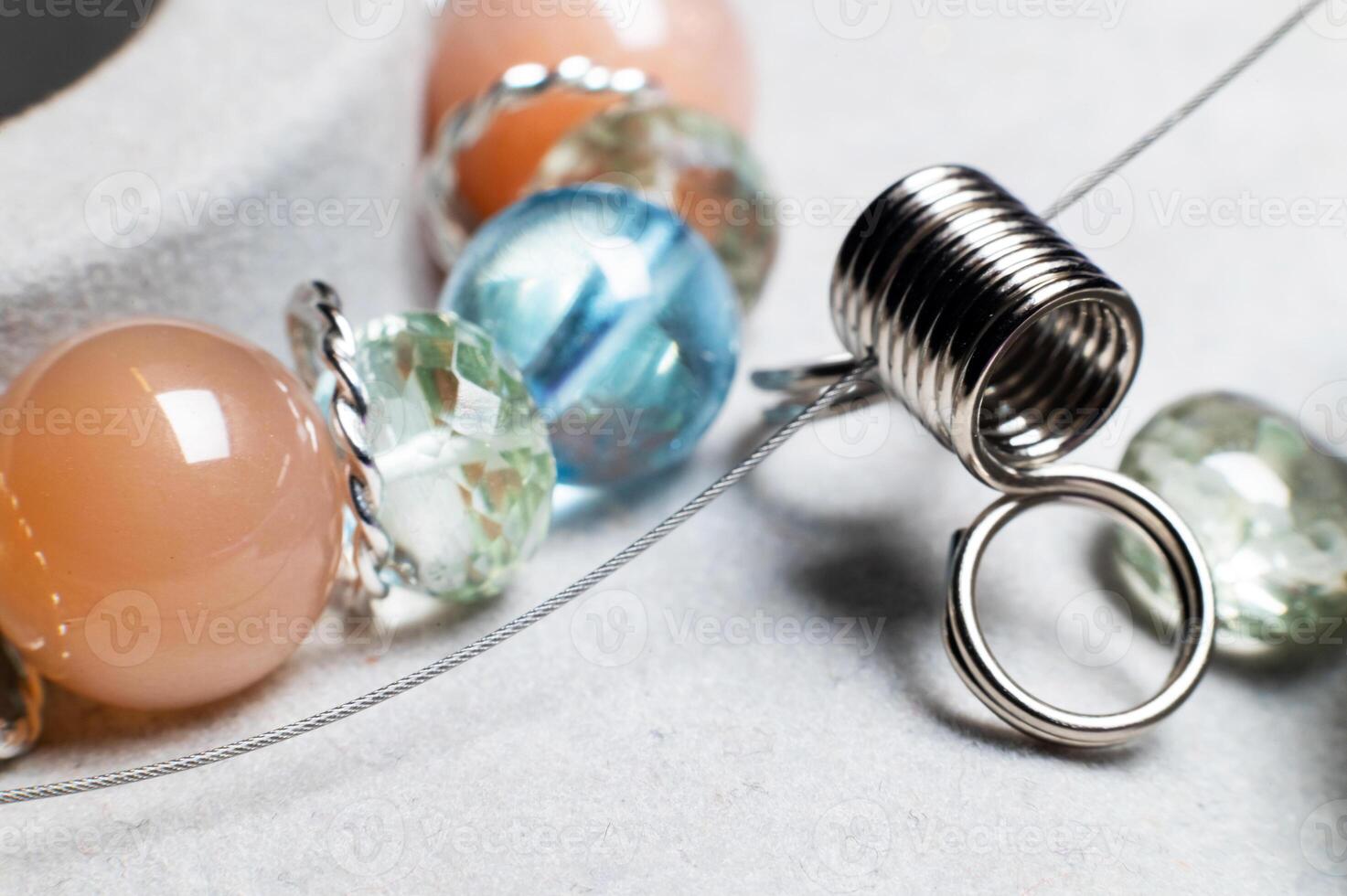 round polished natural stones assembled to create an exclusive health bracelet photo