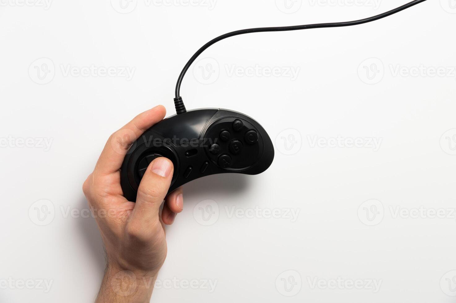 Retro joystick in male hand on a white background. Retro gaming. game photo