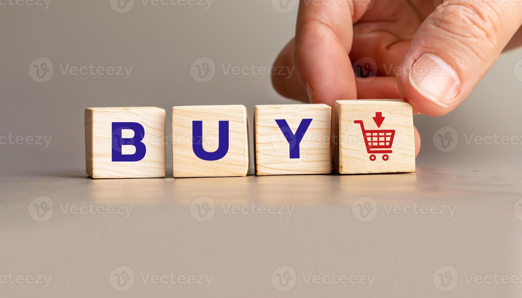 Hand Placing Wooden Blocks Spelling buy with Shopping Cart Icon, Stock Image for E-commerce, Online Shopping, Business Marketing, Product Promotions, and Digital Retail Concepts. photo