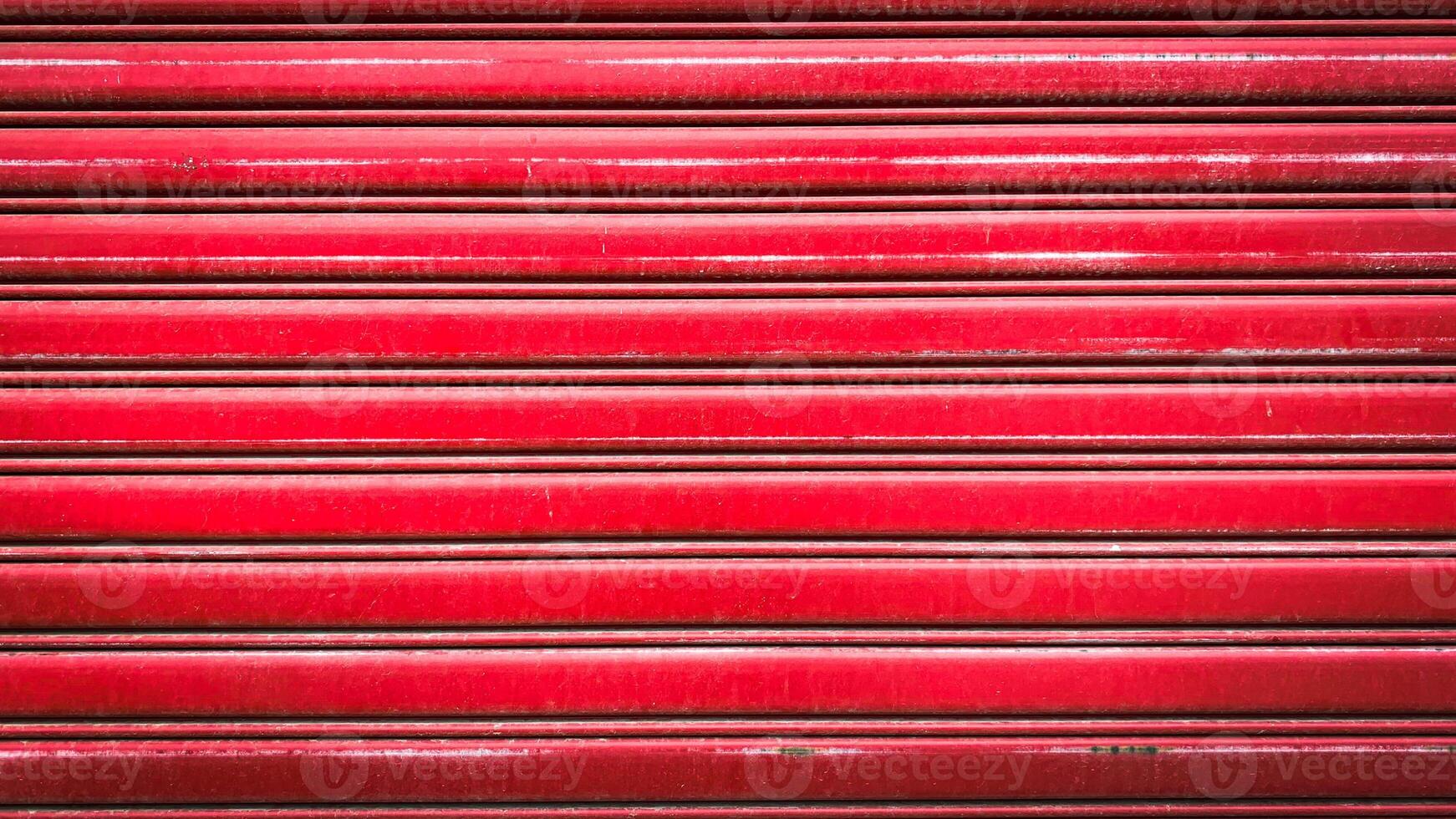 A vibrant red metal rolling door showcasing durability and strength, perfect for industrial and commercial environments. This image represents protection. photo