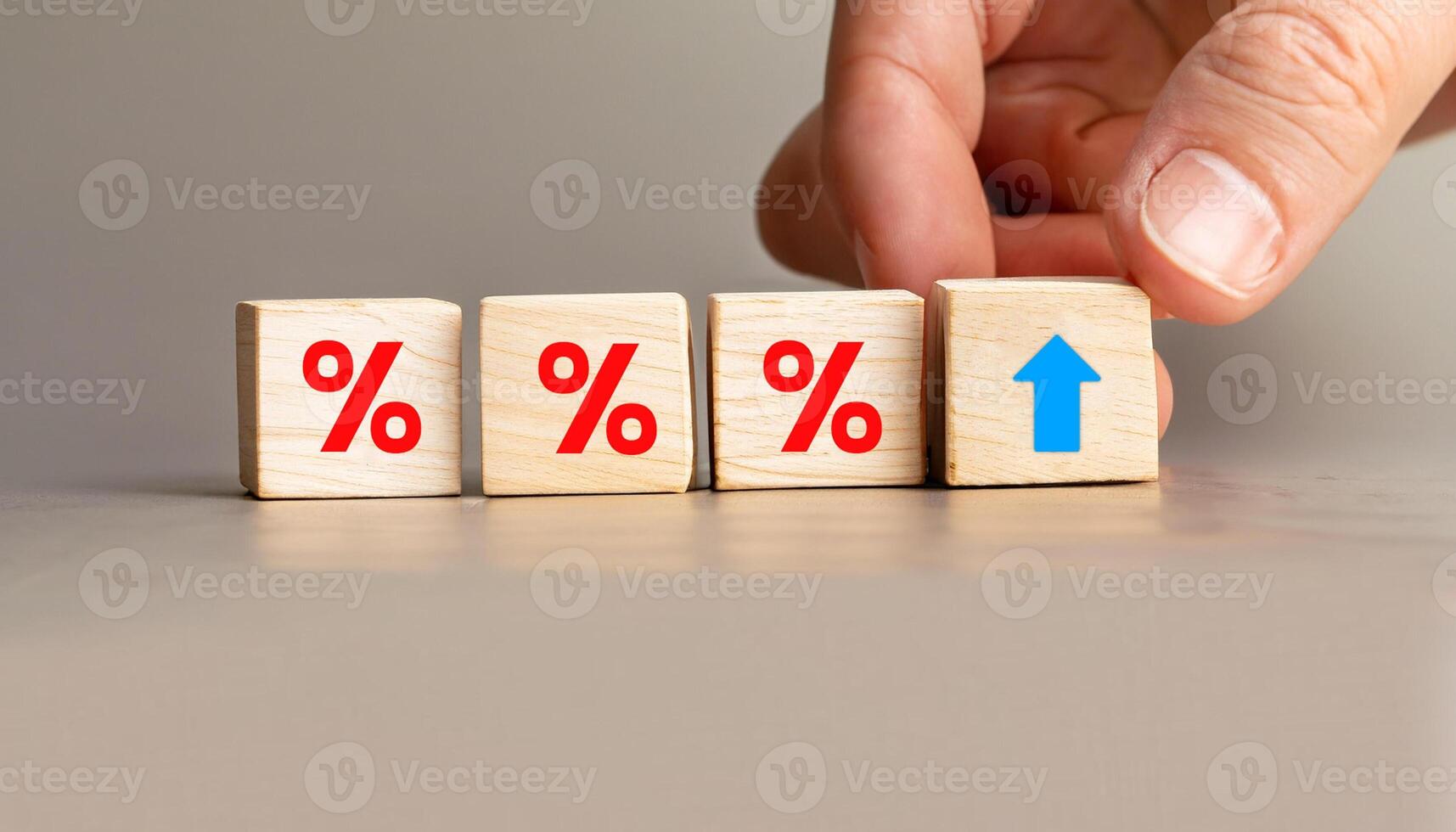 Hand Adjusting Wooden Blocks with Red Percentage Symbols and Upward Arrow Icon, Stock Image for Financial Concepts, Interest Rate Hikes, Business Growth, Economics, and Investment Trends. photo