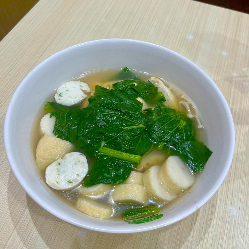Warm up with a bowl of seafood soup, brimming with fresh flavors and ocean goodness photo