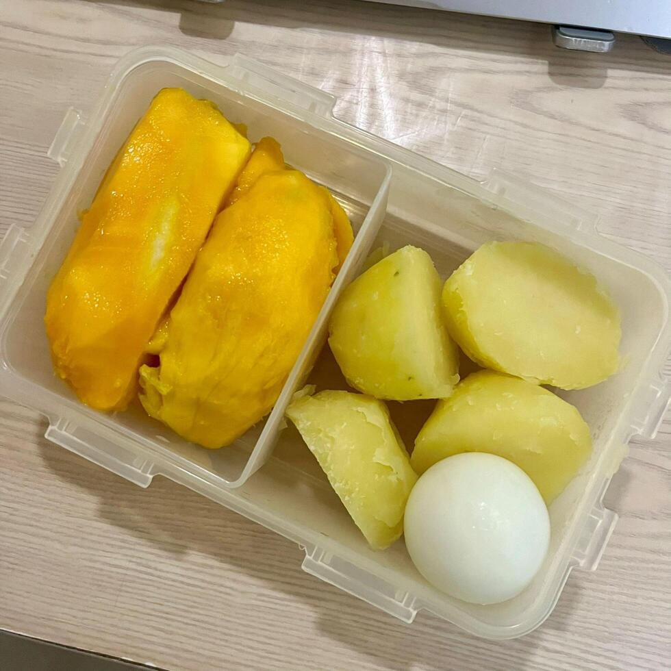 Wholesome and vibrant. Enjoying a colorful plate of boiled nutrition and fresh fruit, simple, healthy, and delicious photo