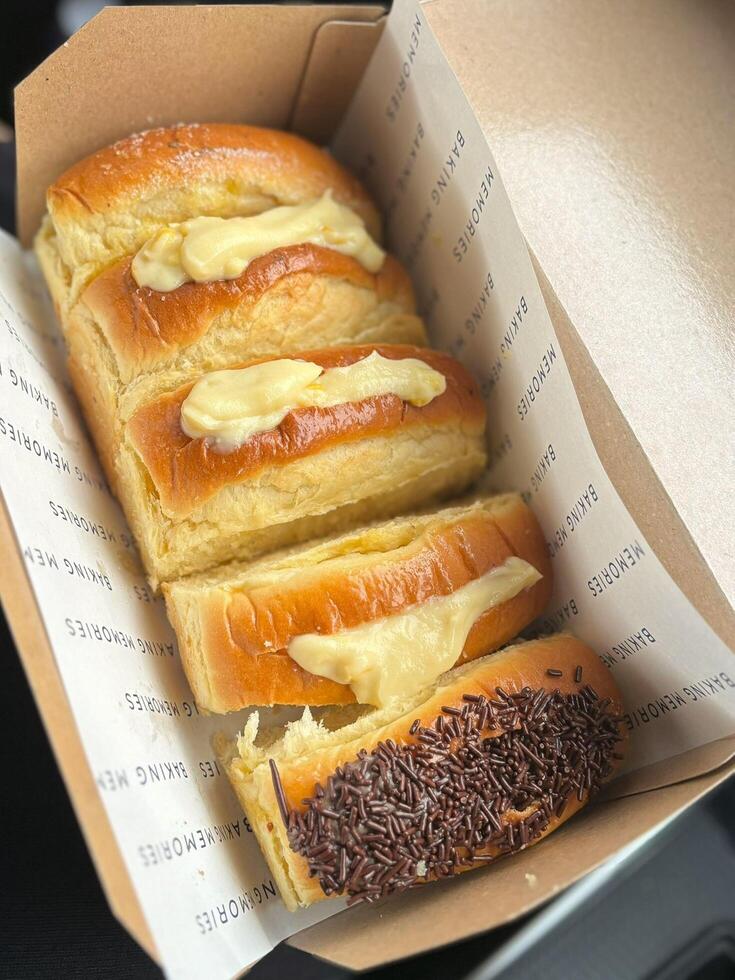 Roti Sisir, Soft, fluffy bread with a golden crust and a touch of buttery sweetness. Perfect for breakfast or a light snack, each slice melts in your mouth. photo
