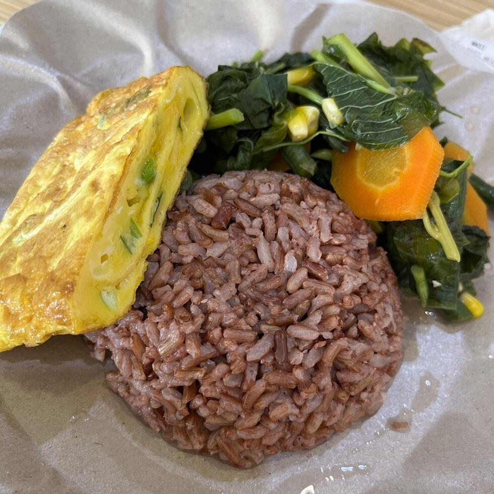 Nasi Warteg, each plate offers a diverse array of flavors and textures, showcasing traditional Indonesian home cooked goodness in every bite. It is a colorful celebration of taste and culture photo