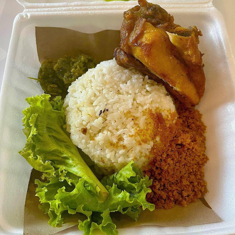 Indulging in Nasi Ayam Kremes, crispy, tender, and utterly delicious photo