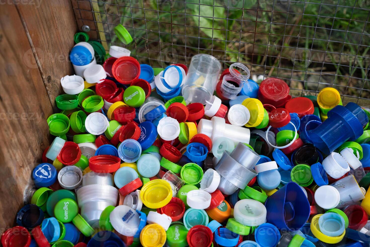 A container designed for collecting plastic bottle caps. photo