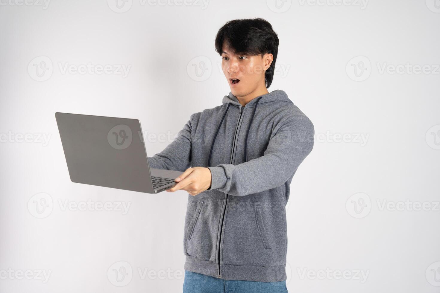 Portrait of asian man wearing hoodie posing on white background photo