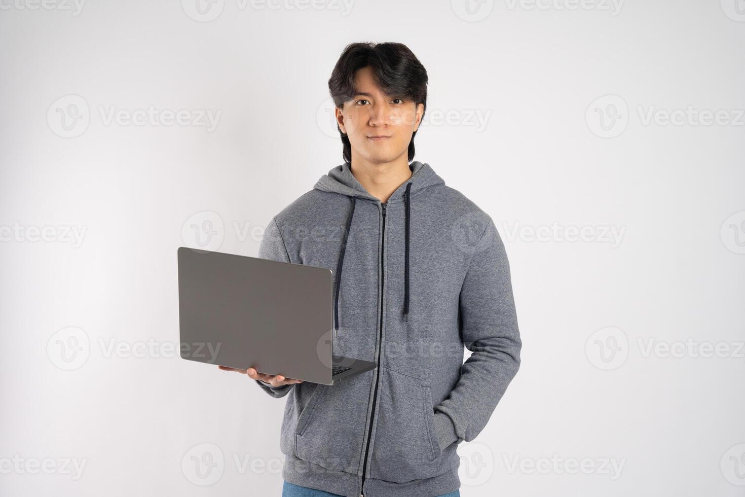 Portrait of asian man wearing hoodie posing on white background photo