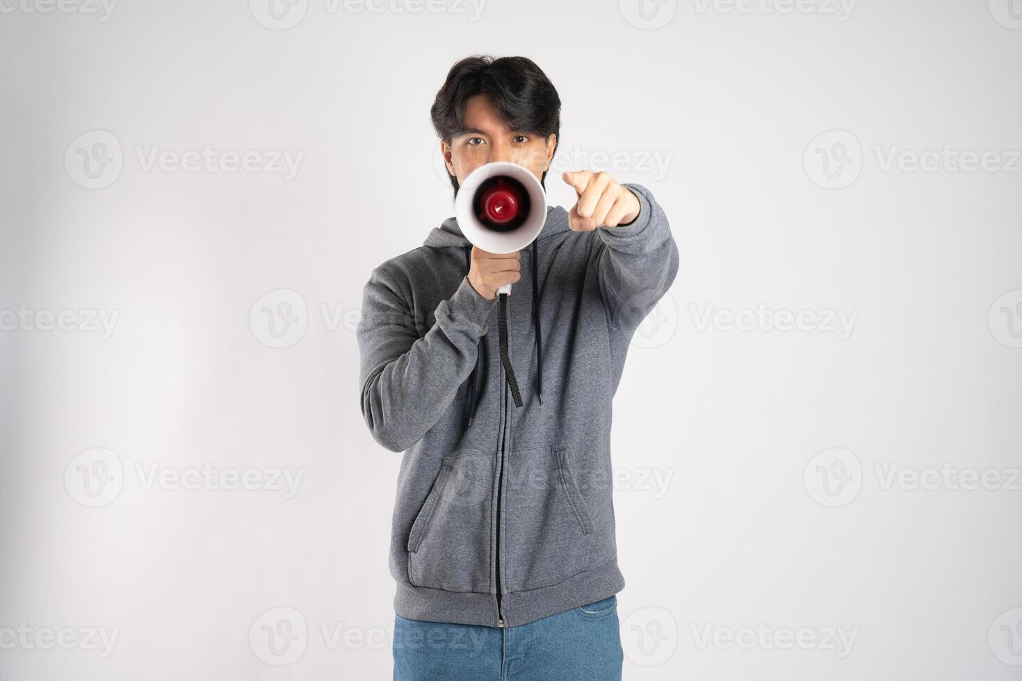 Portrait of asian man wearing hoodie posing on white background photo