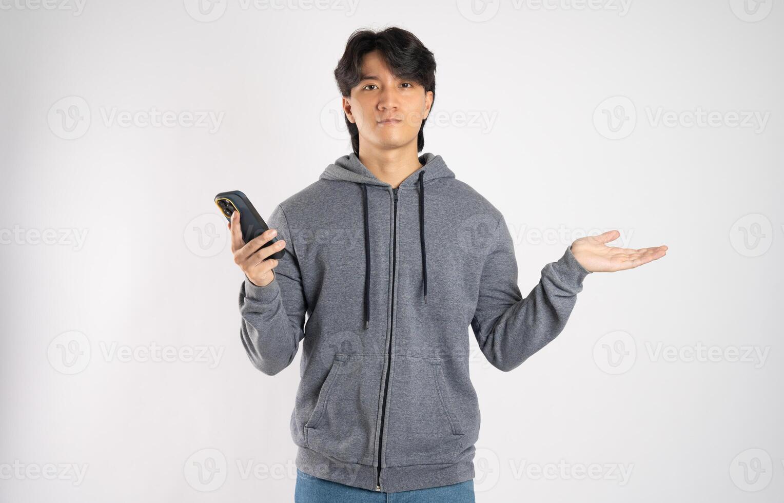 Portrait of asian man wearing hoodie posing on white background photo