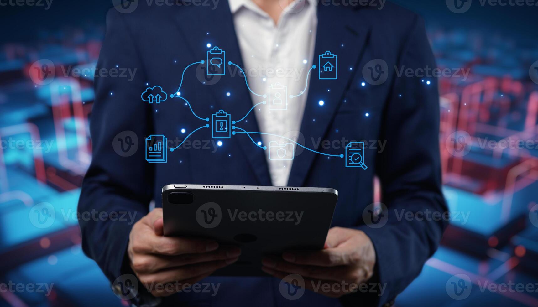 Businessman holding tablet with icons on background photo