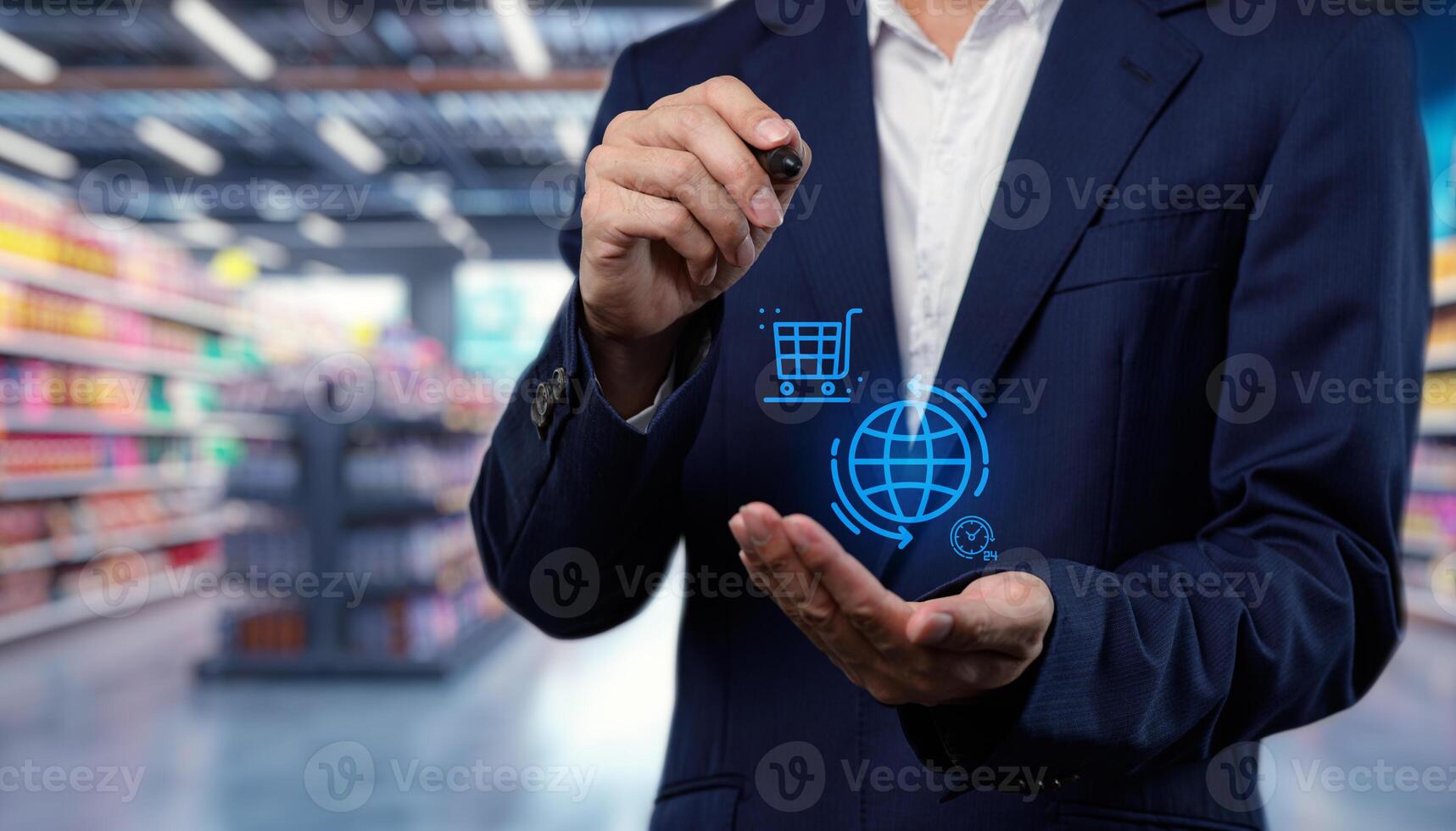 Man in business suit holding virtual shopping cart in supermarket photo