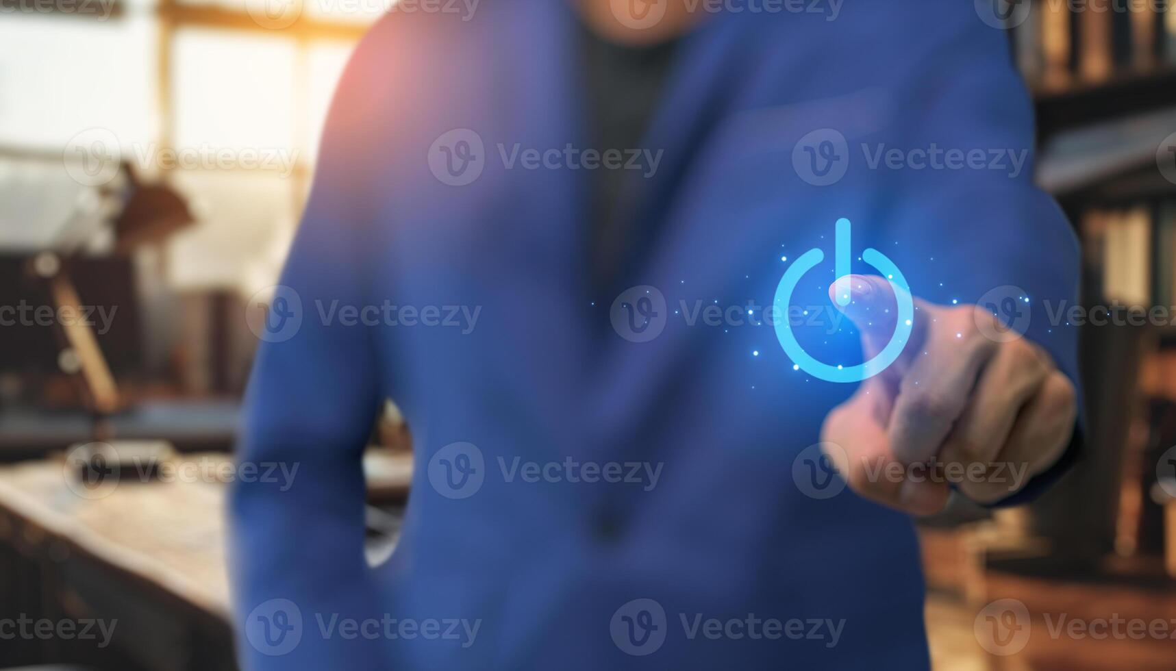 Businessman in suit pressing power button on screen photo