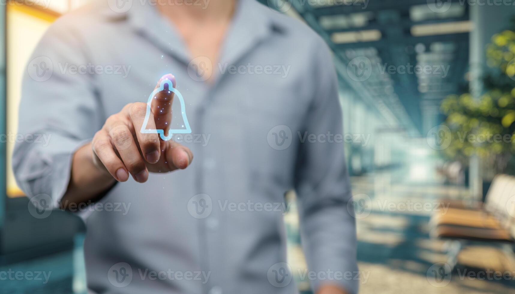 A man is holding a virtual button on a screen photo