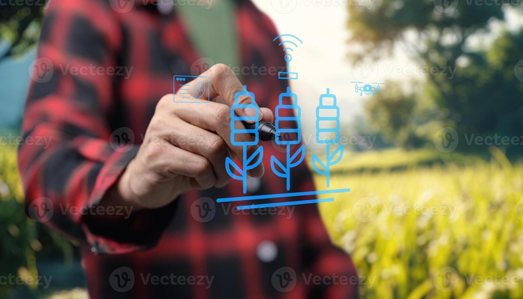 A man is drawing a farm on a screen photo