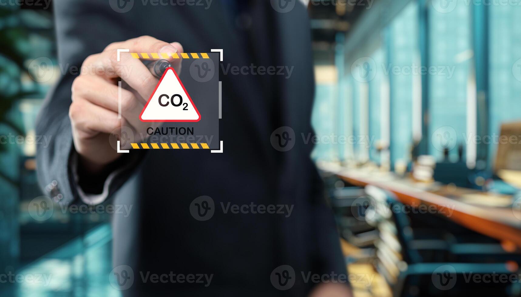 A man in a suit holding a sign with a qo sign on it photo