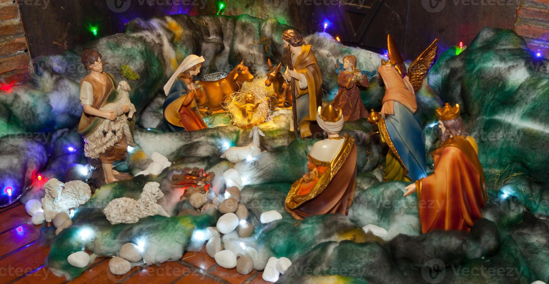 A nativity scene with christmas lights on it photo