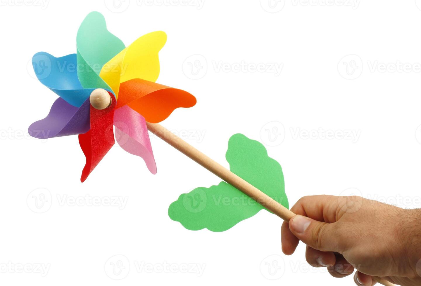 A hand holding a colorful pinwheel on a stick photo