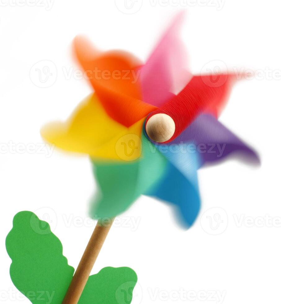 A pinwheel with a colorful flower on top photo
