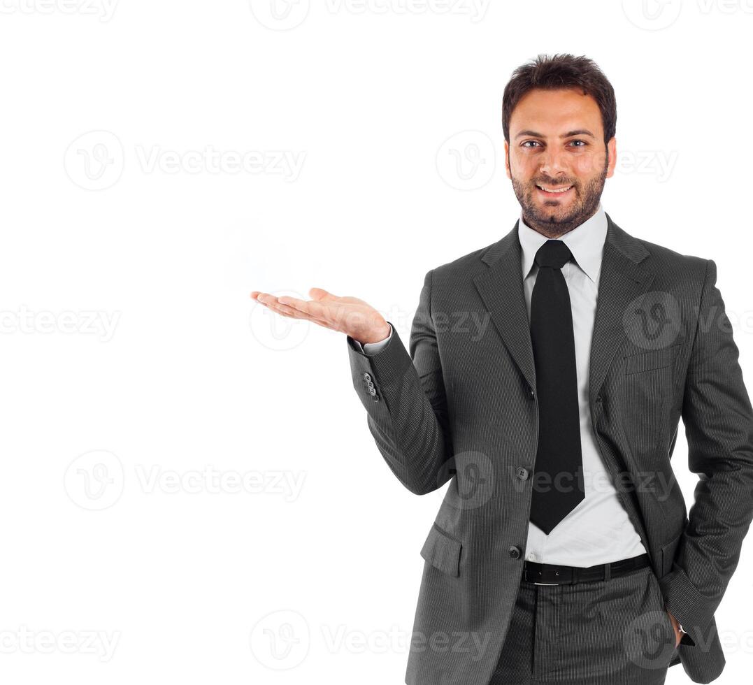 A man in a suit is holding something up photo