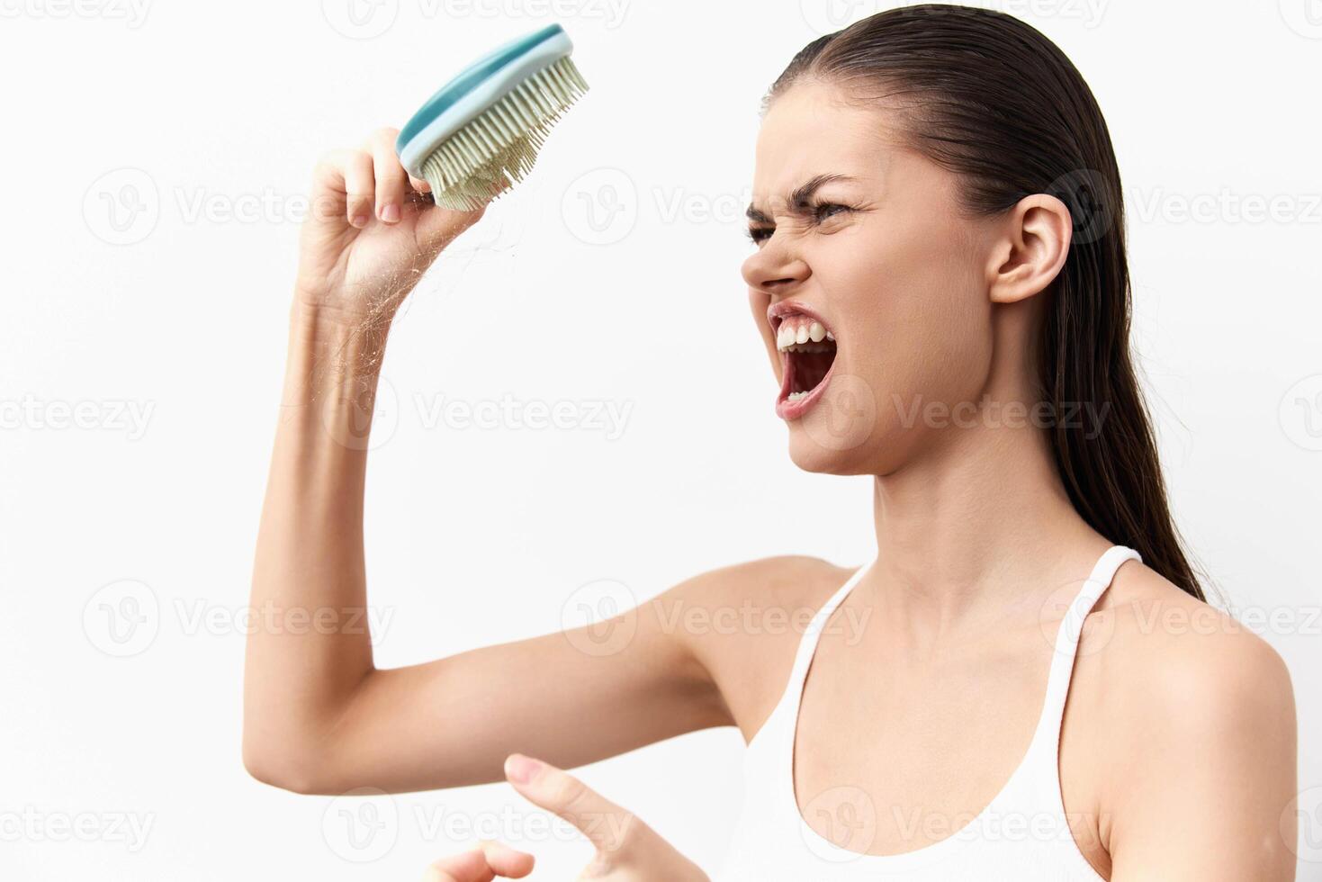 A young woman showcasing intense emotion and frustration with an aggressive expression while photo