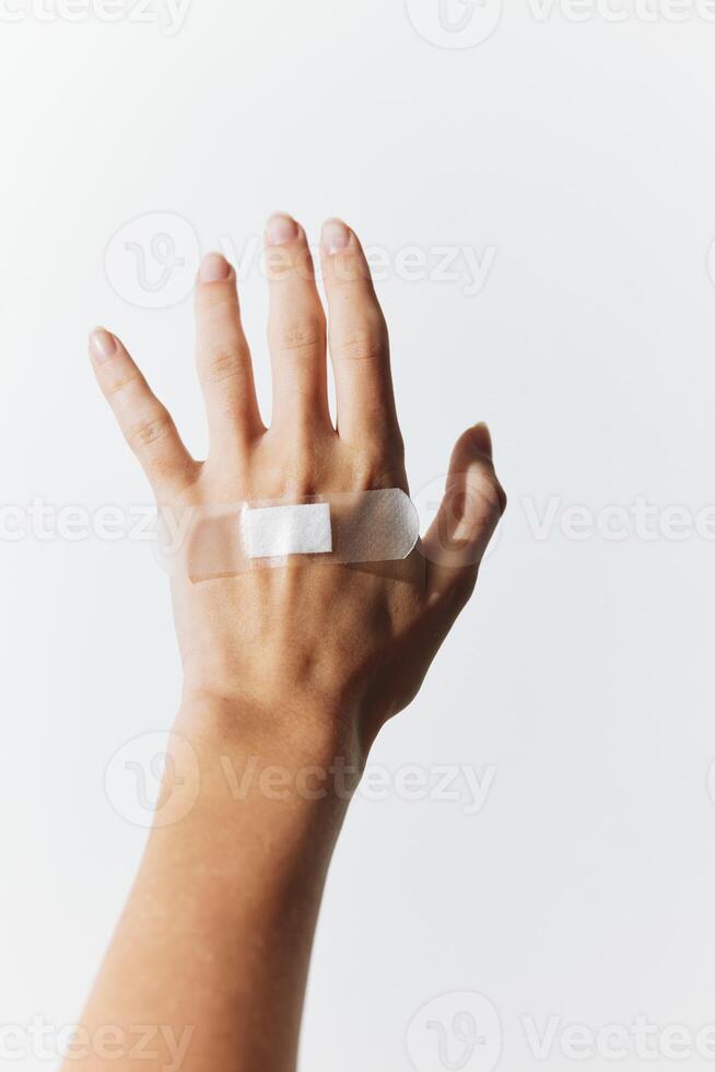 Wrist bandage held in hand with adhesive bandage on white background. image suitable for medical and photo