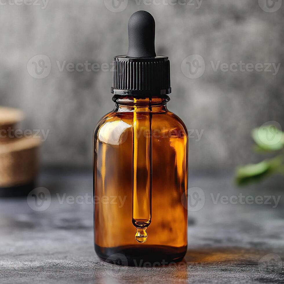 Amber glass dropper bottle with black lid on a rustic surface, ideal for oils or serums. photo