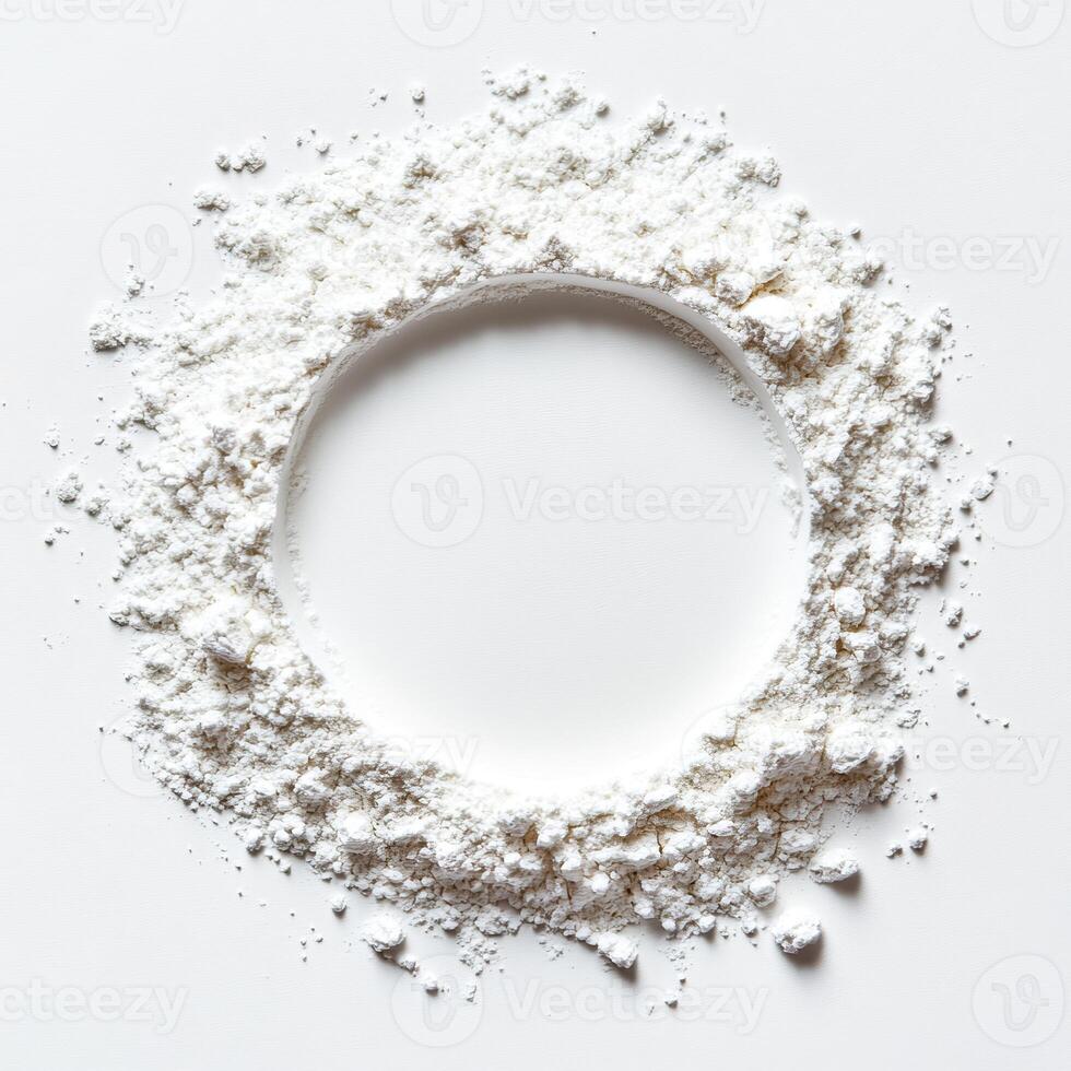 Fine white powder arranged in a circular frame on a clean surface. photo