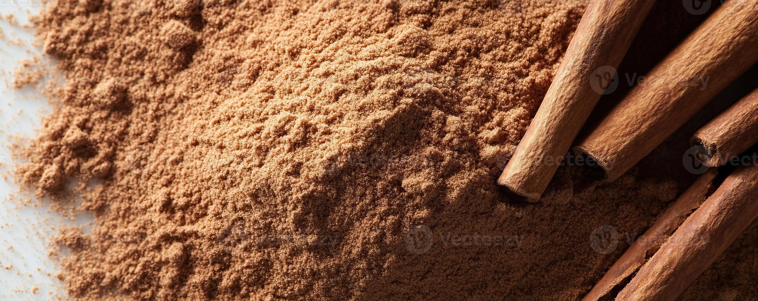 Cinnamon powder with sticks on a white isolate background. photo