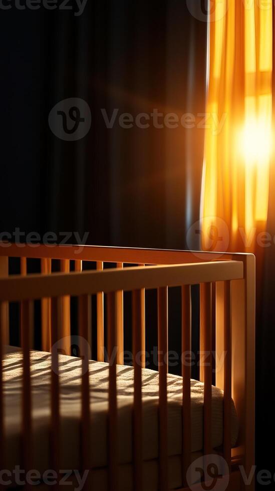 Cozy nursery with a wooden crib illuminated by warm, golden sunlight streaming through a window. photo