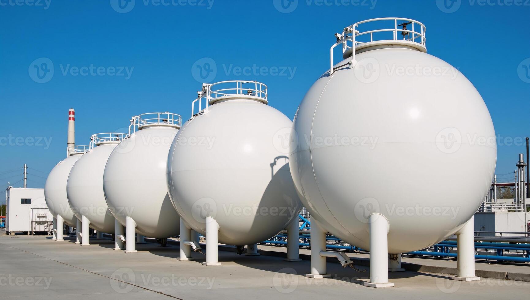 A 3D rendering of a modern petrochemical factory featuring spherical BPVC gas storage tanks under a bright blue sky photo
