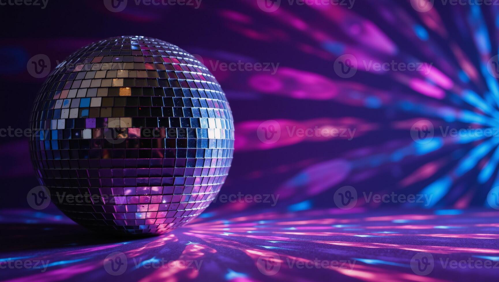 A disco ball shines against an abstract backdrop of colored rays and light effects Purple Pink Blue photo