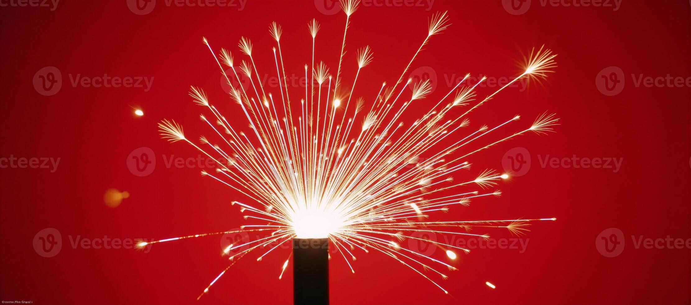 Fireworks illuminate against a striking red backdrop photo
