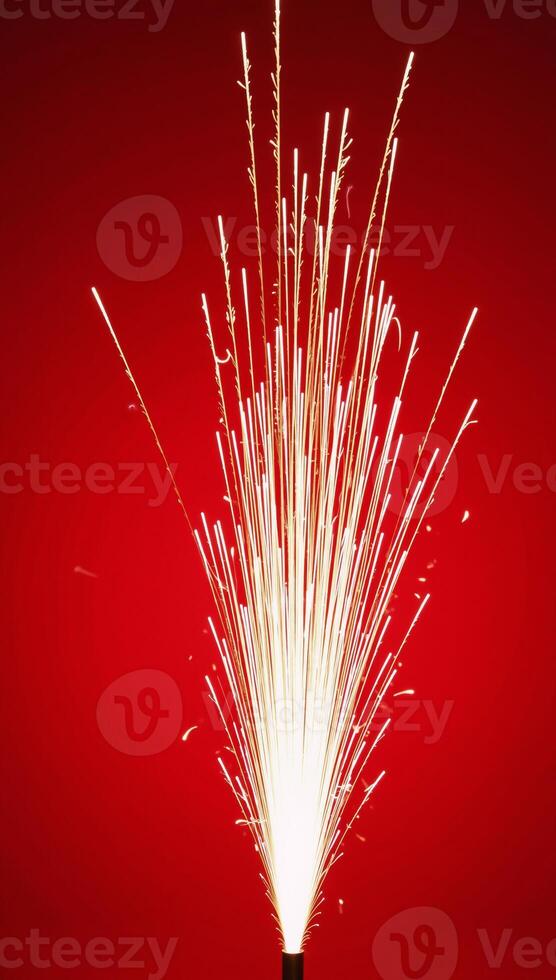 Fireworks illuminate against a striking red backdrop photo
