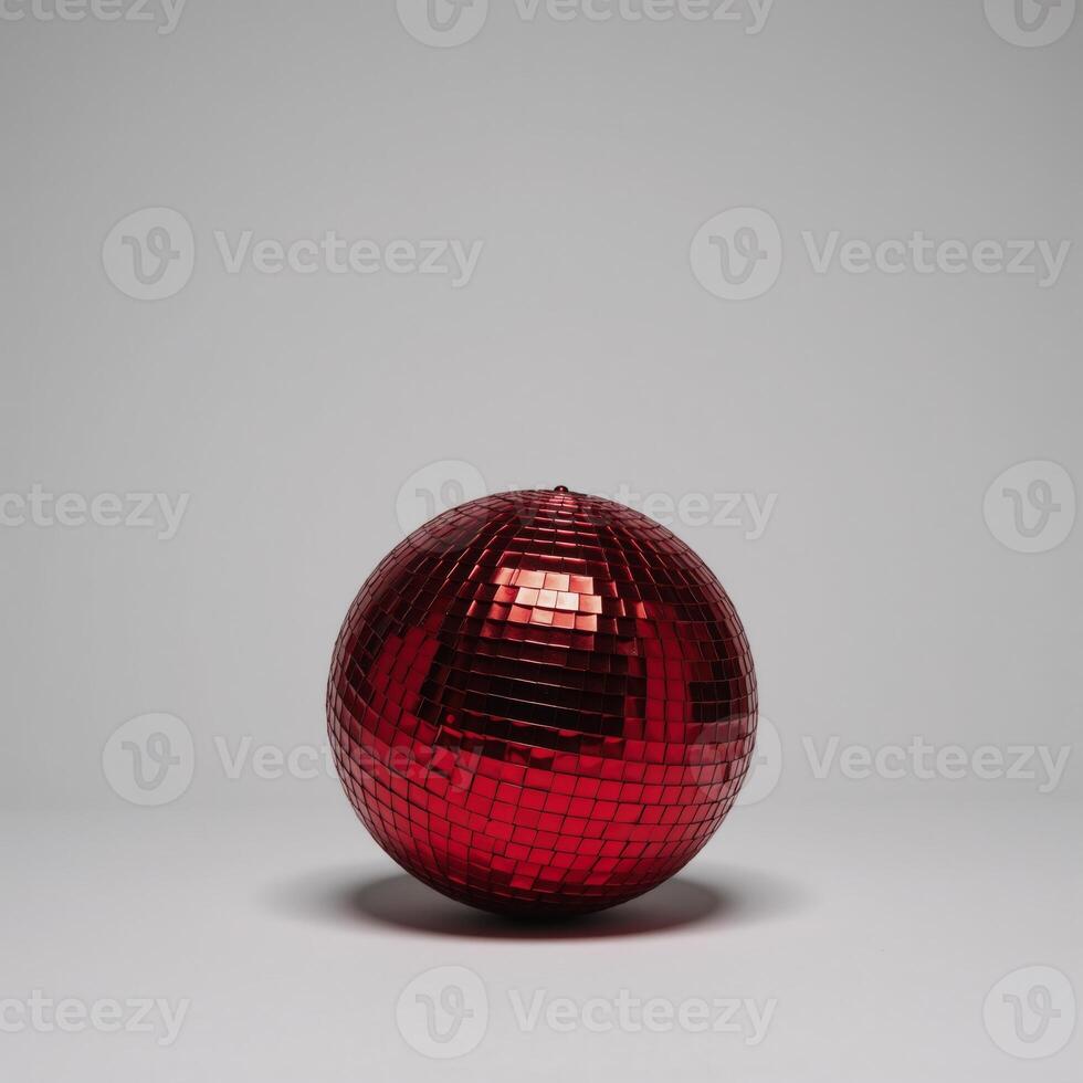 Isolated red disco ball glows against blank canvas backdrop photo