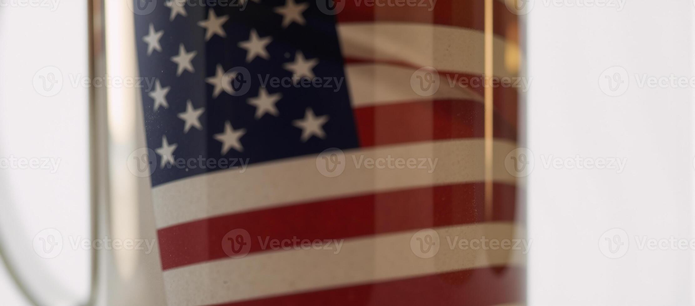 Closeup minimalist drawing highlighting the symbolic contrast between an American flag reflection and a frosty beer mug photo