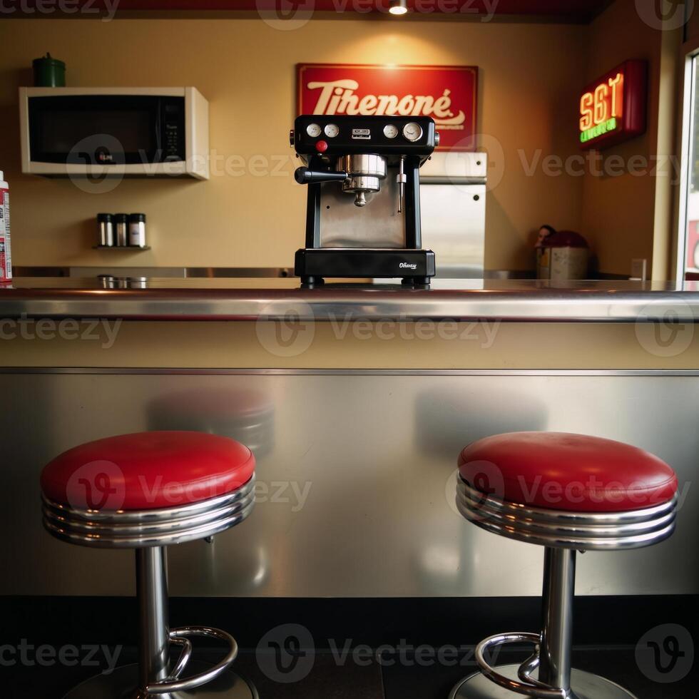 A retro diner counter featuring coffee maker and stools photo