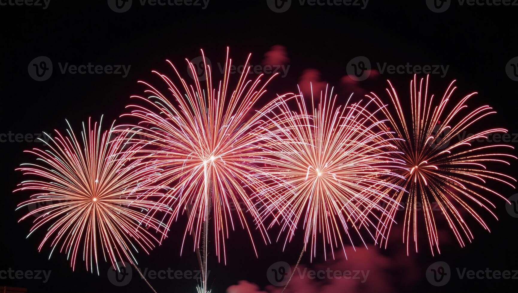 Colorful fireworks illuminate a night sky on a black backdrop photo