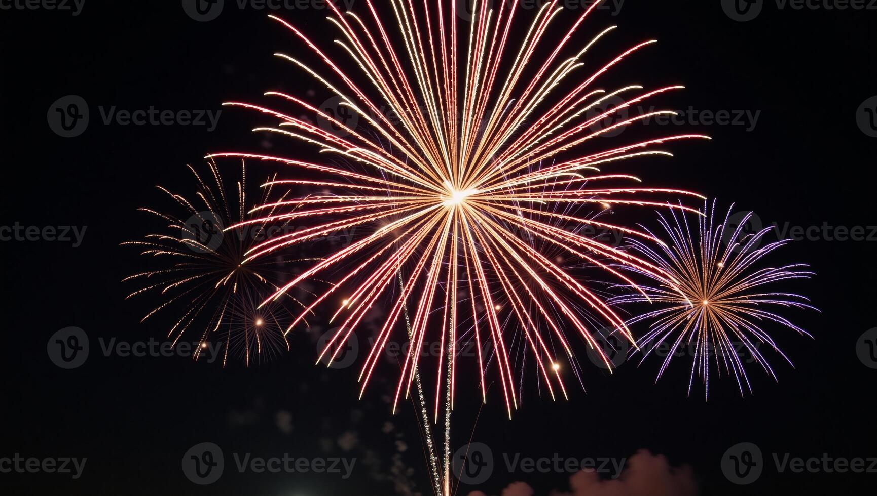 Nighttime firework explosion over a 4th of July themed backdrop photo