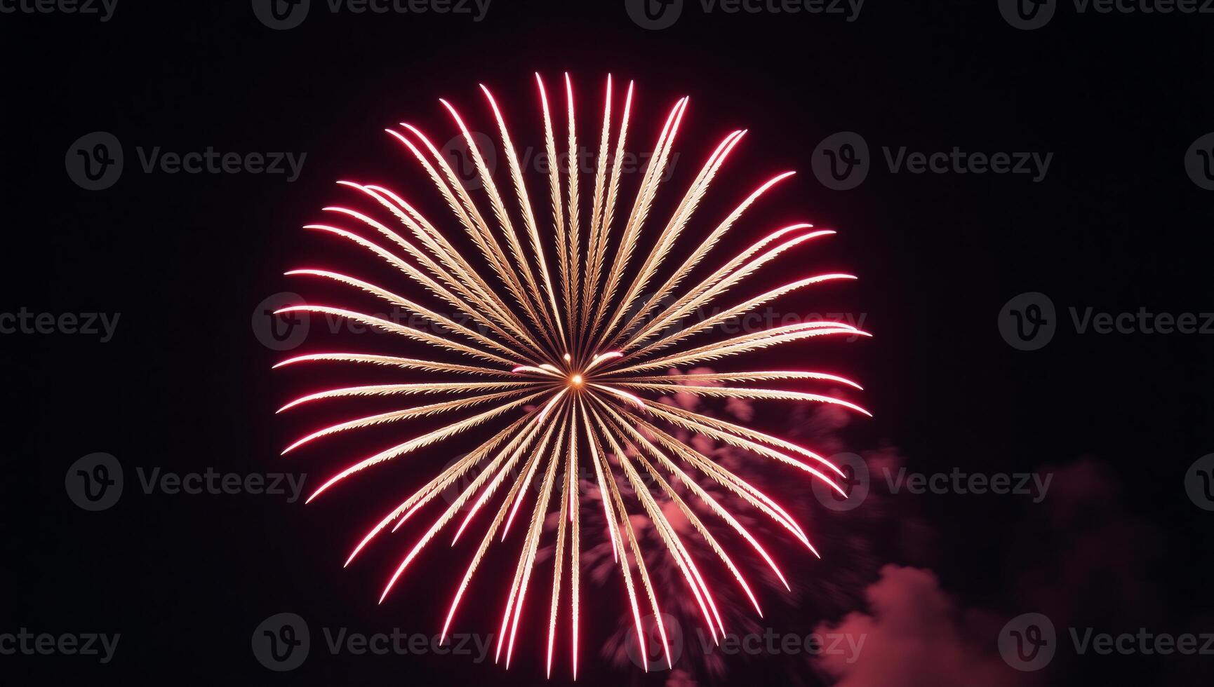 A striking shot showcasing a brightly glowing starburst from exploding fireworks against a dark backdrop at night photo