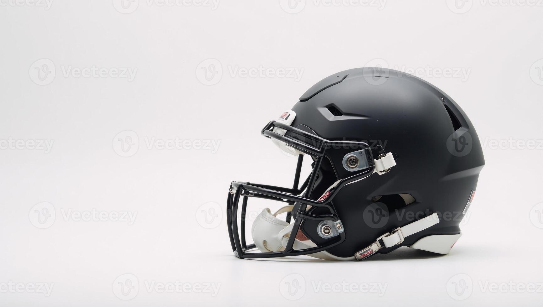 A modern American football helmet fills a crisp white backdrop with intricate details and striking clarity photo